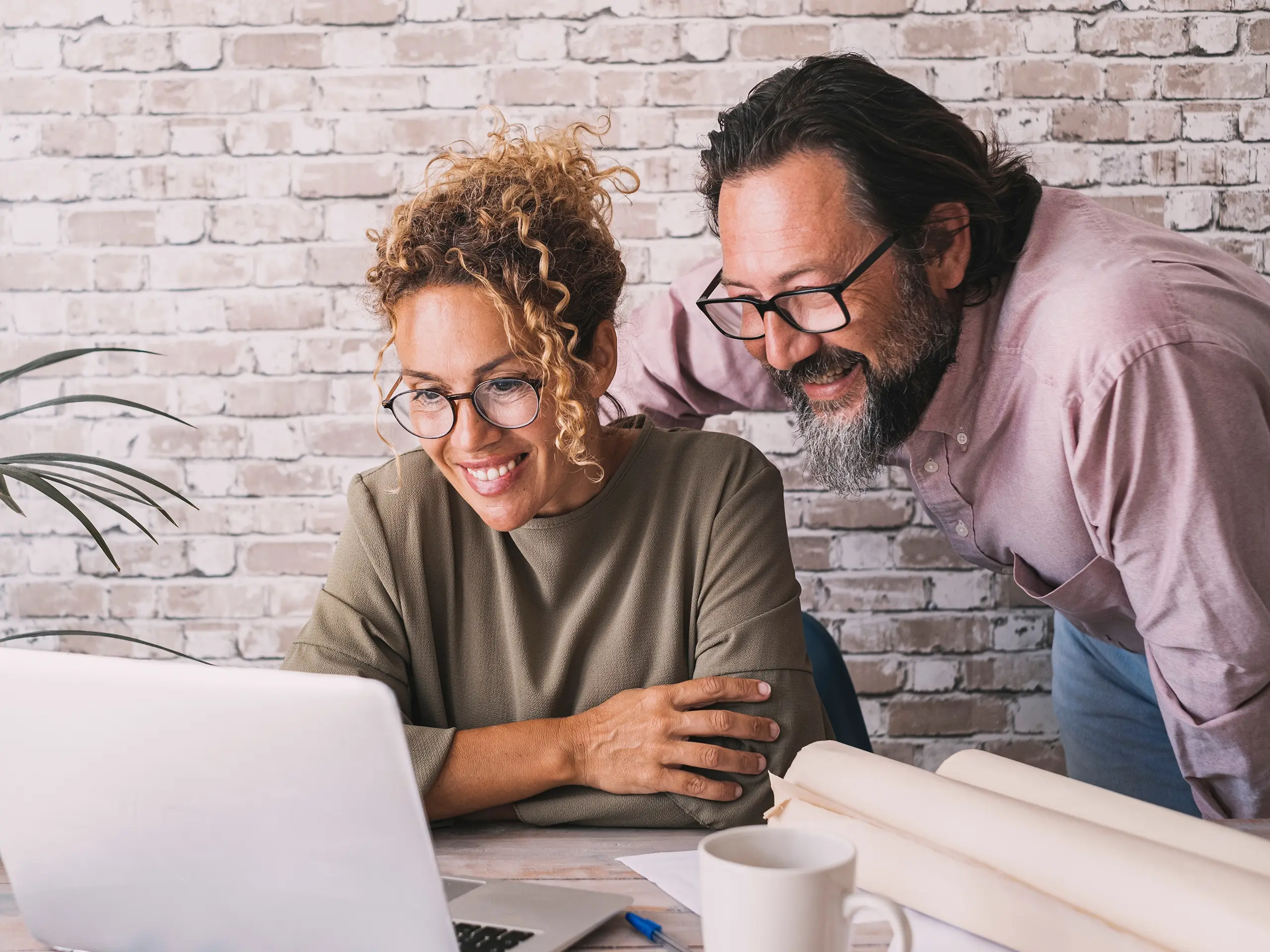 Couple checking on laptop, computer, working from home