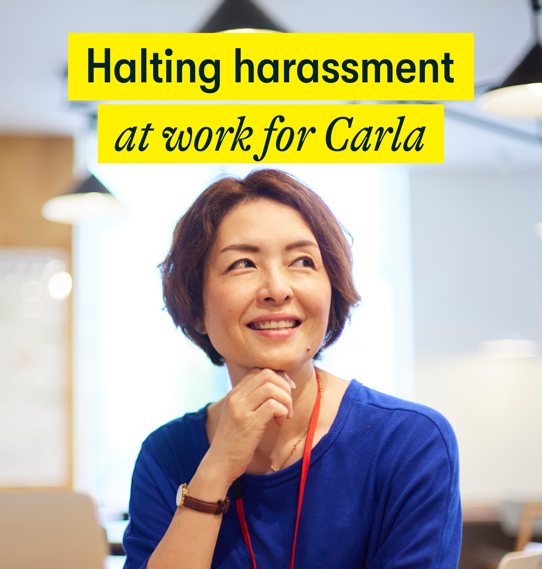 Halting harassment at work for Carla Halting harassment at work for Carla - a middle aged woman sits in an office looking happy
