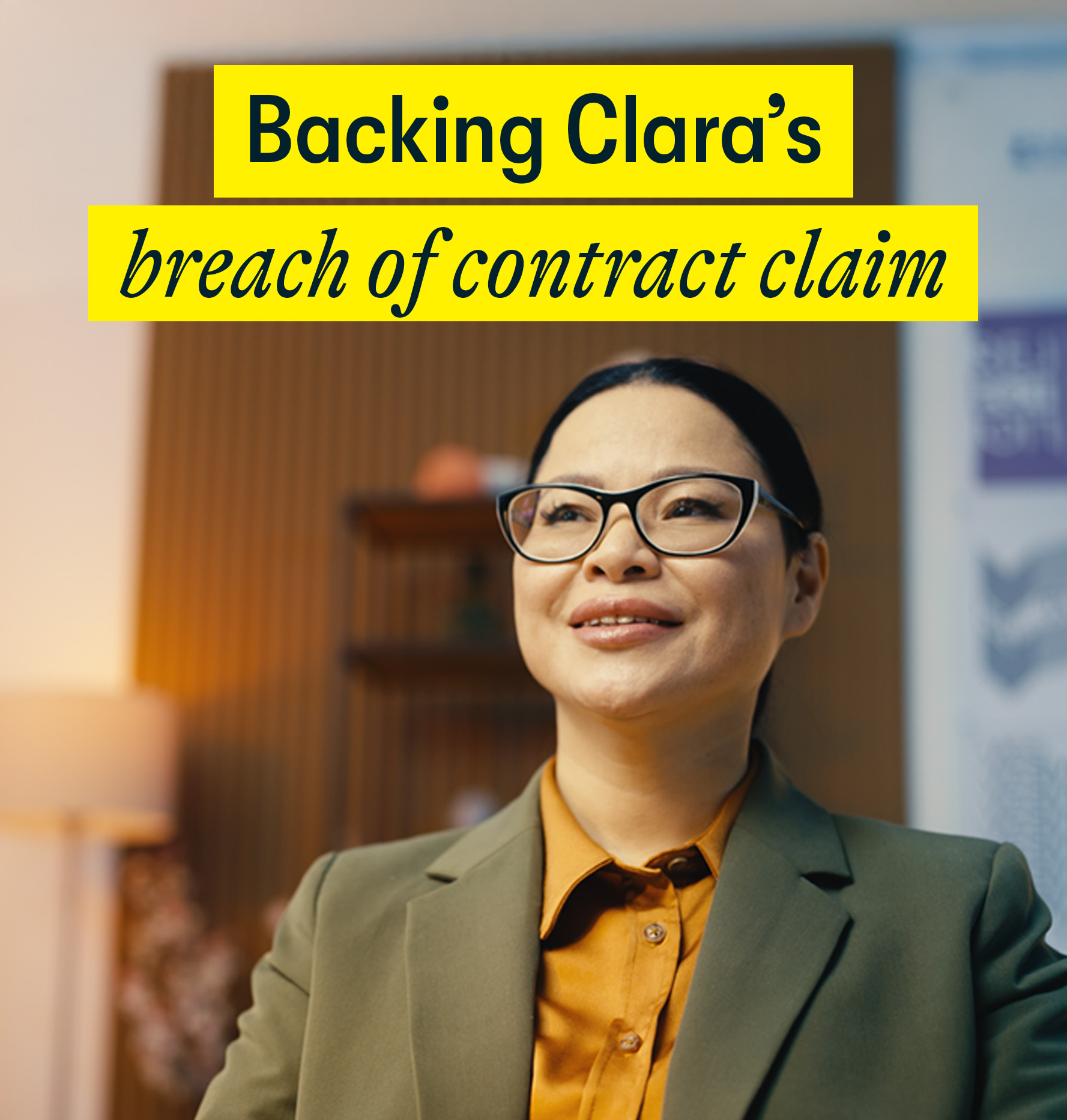 Backing Clara's breach of contract claim Backing Clara's breach of contract claim - a 40's woman sits in her office smiling